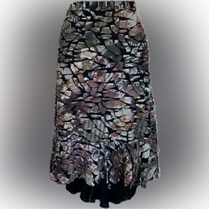 ANTHRO IDOM skirt, camo print, hi-lo, fabric scraps on a black background. S EUC